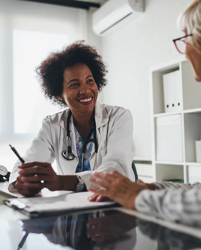 Female physician speaking to patient