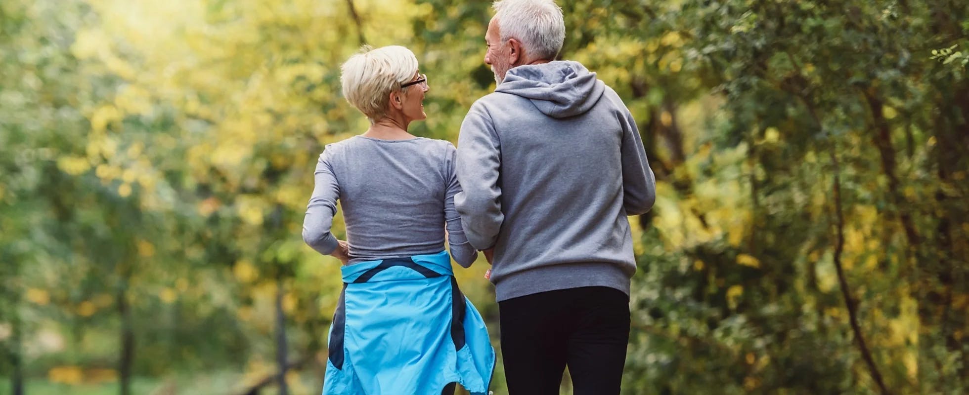 image of elderly couple jogging together 